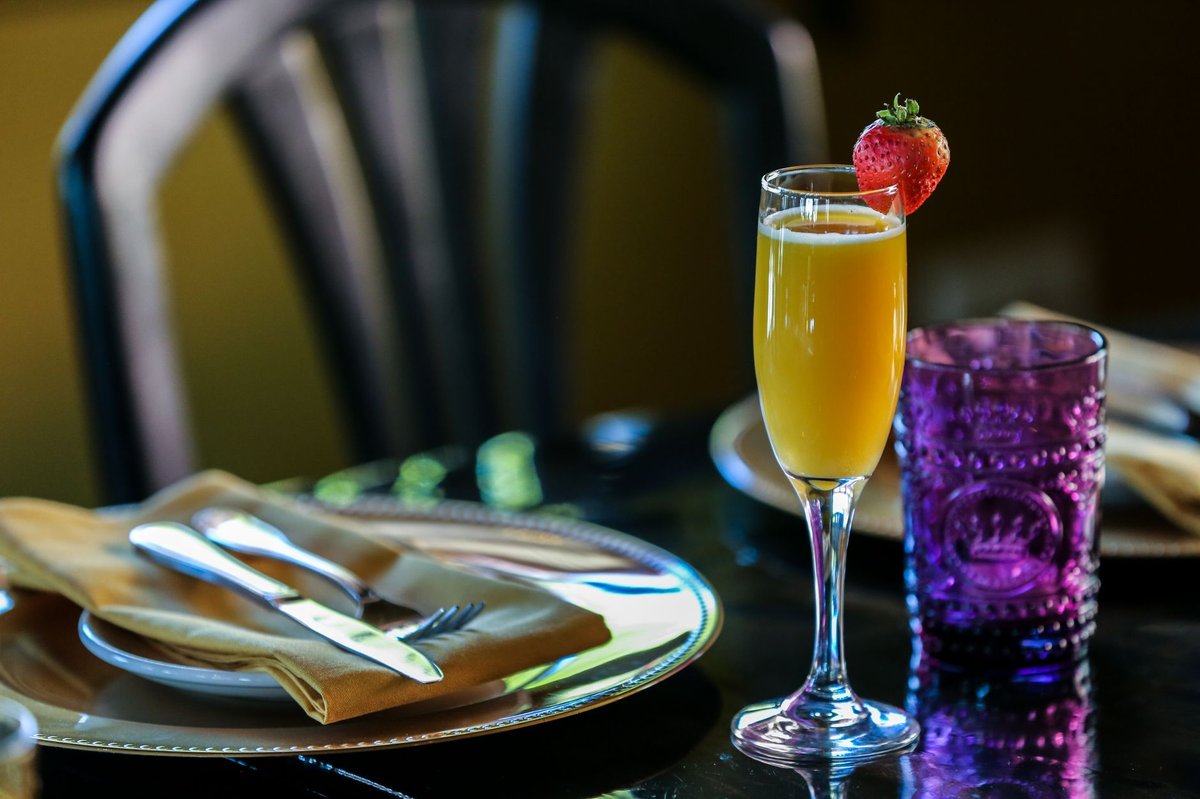 a brunch table with mimosas