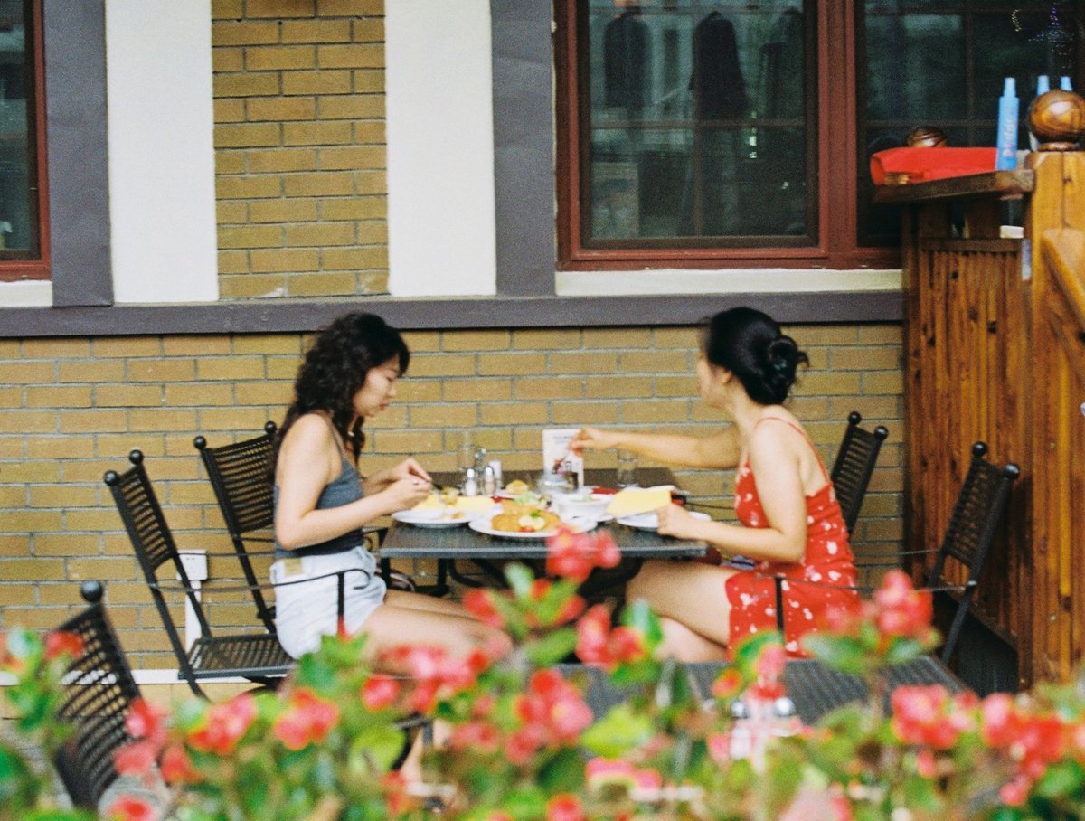 diners on a sunny restaurant patio