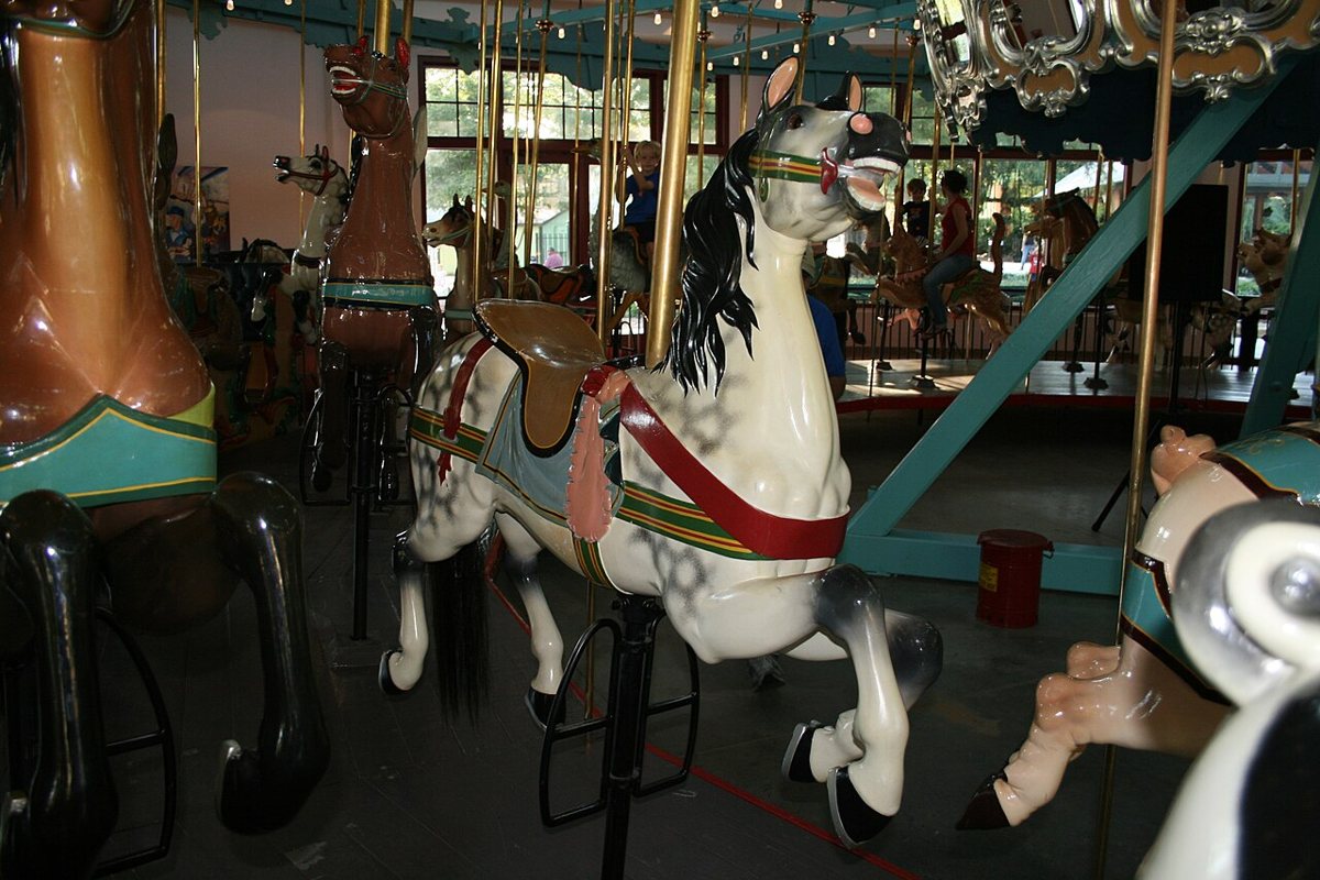 Historic carousel and lake with paddle boats at Pullen Park in Raleigh in spring