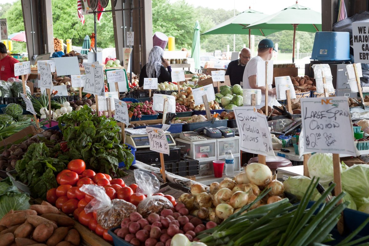 produce stalls at the NC State Farmers Market in Raleigh